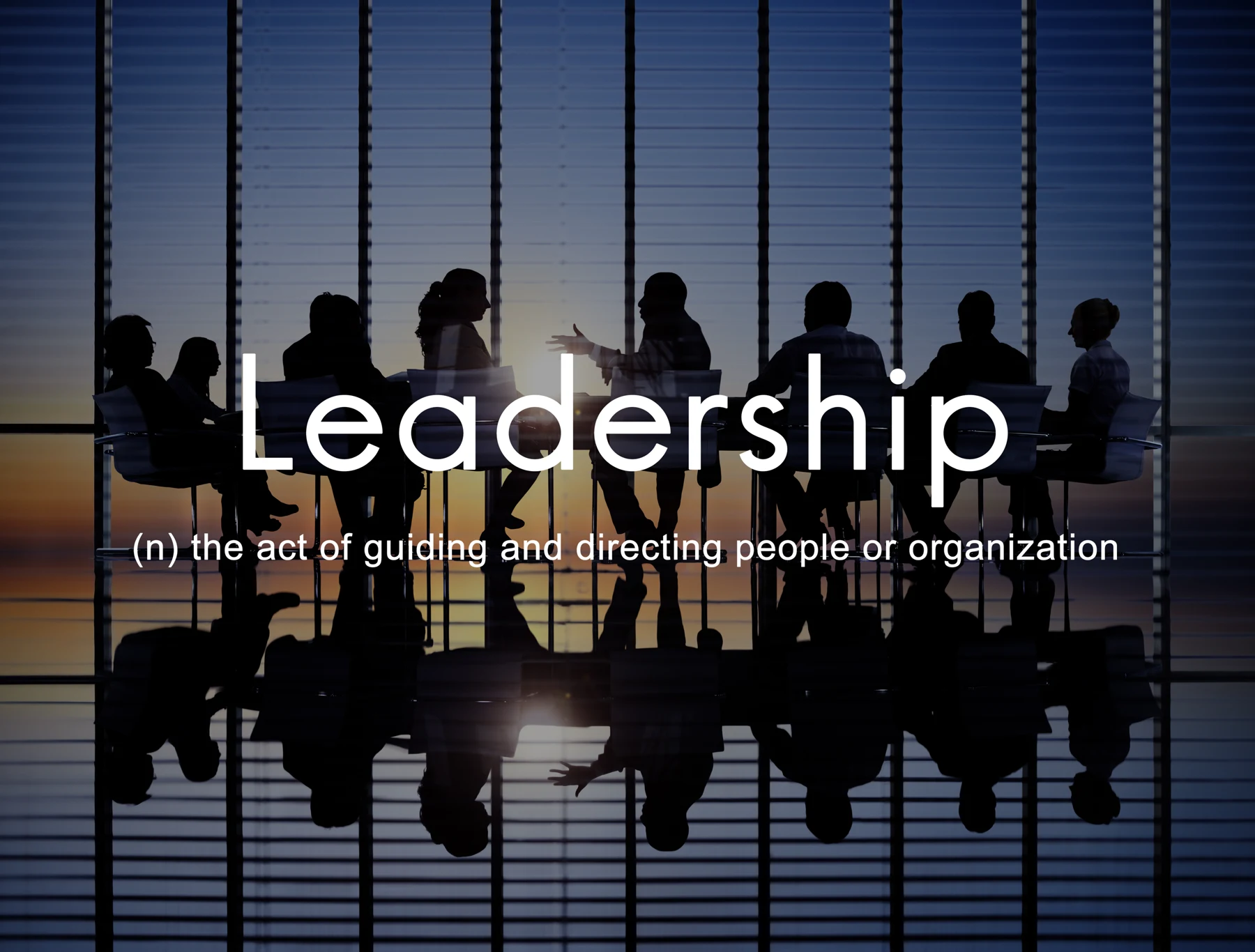 Leadership definition set over a leadership team in discussion