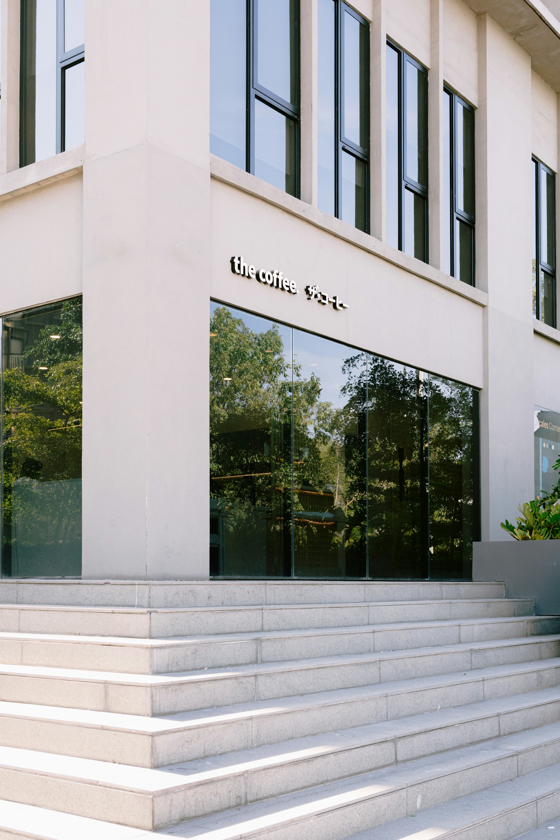 A modern architectural entrance defined by light, proportion and shadow